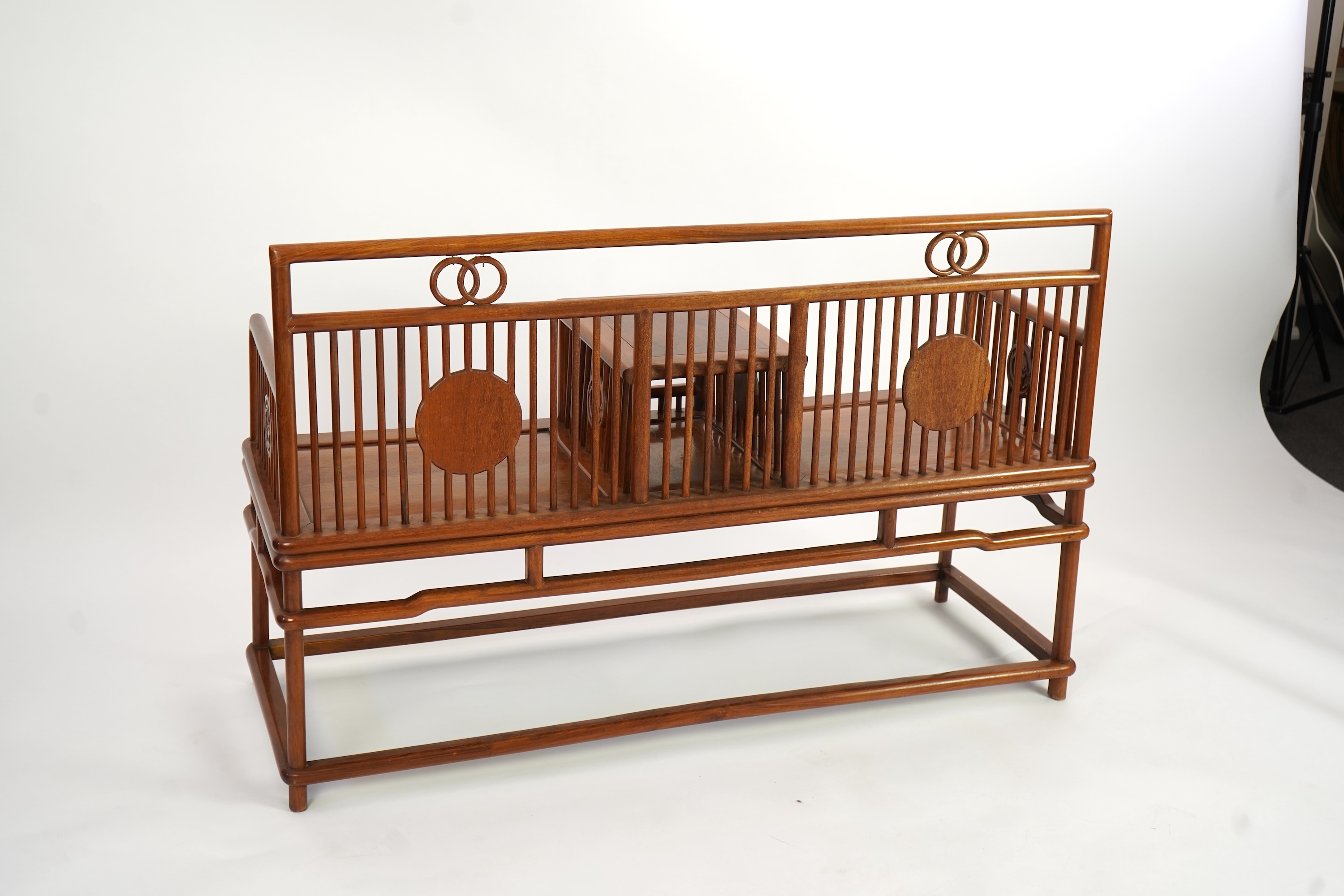 A Chinese hardwood and burrwood inset spindle-back bench, early 20th century